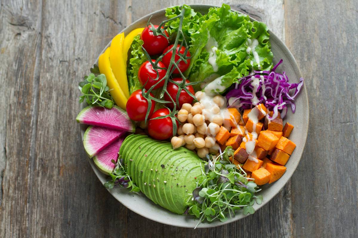 Visual pyramid showing layers of a gut healing diet: foundation = diverse plants & prebiotics, mid-layer = fermented foods & bone broth, top = targeted supplements like L-glutamine